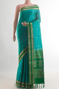 Pure Silk Turquoise Soft Saree with Zari Butta on the body and Zari Border.  displayed on a mannequin