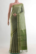 Pure Silk Sage Green Soft Saree with Zari Butta on the body and Zari Border.  displayed on a mannequin