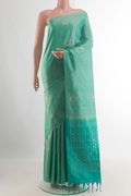 Pure Silk Sea Green Soft Saree with Zari Butta on the body and Without Border.  displayed on a mannequin