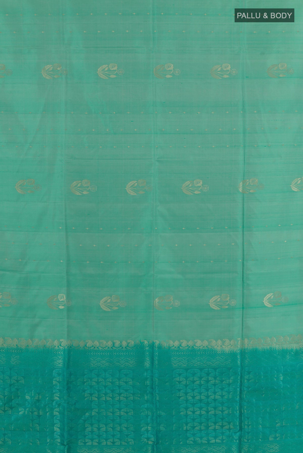 Flat view of Pure Silk Sea Green Soft Saree with Zari Butta on the body and Without Border. 