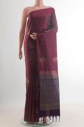 Pure Silk Maroon Soft Saree with Zari Butta on the body and Without Border.  displayed on a mannequin