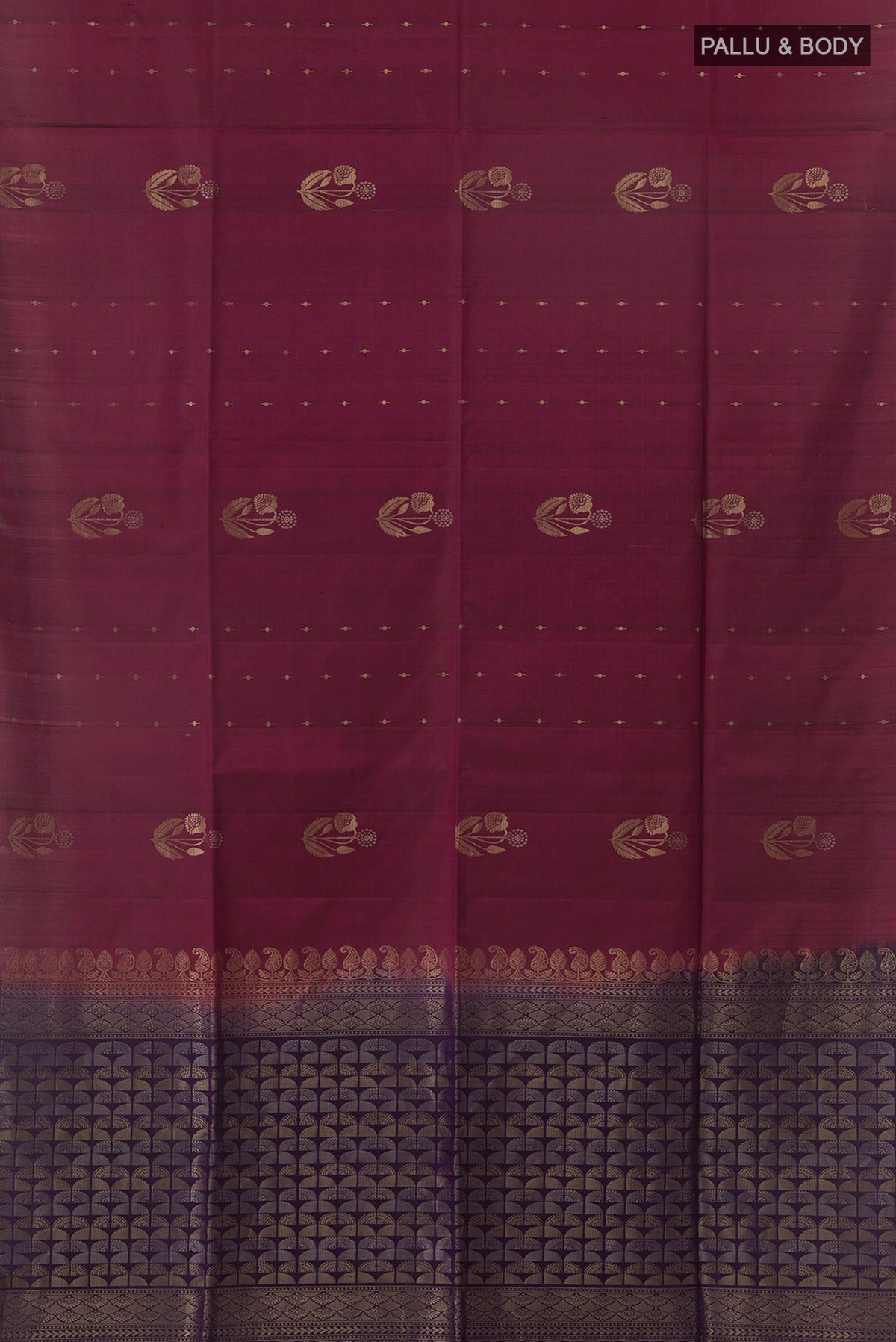 Flat view of Pure Silk Maroon Soft Saree with Zari Butta on the body and Without Border. 