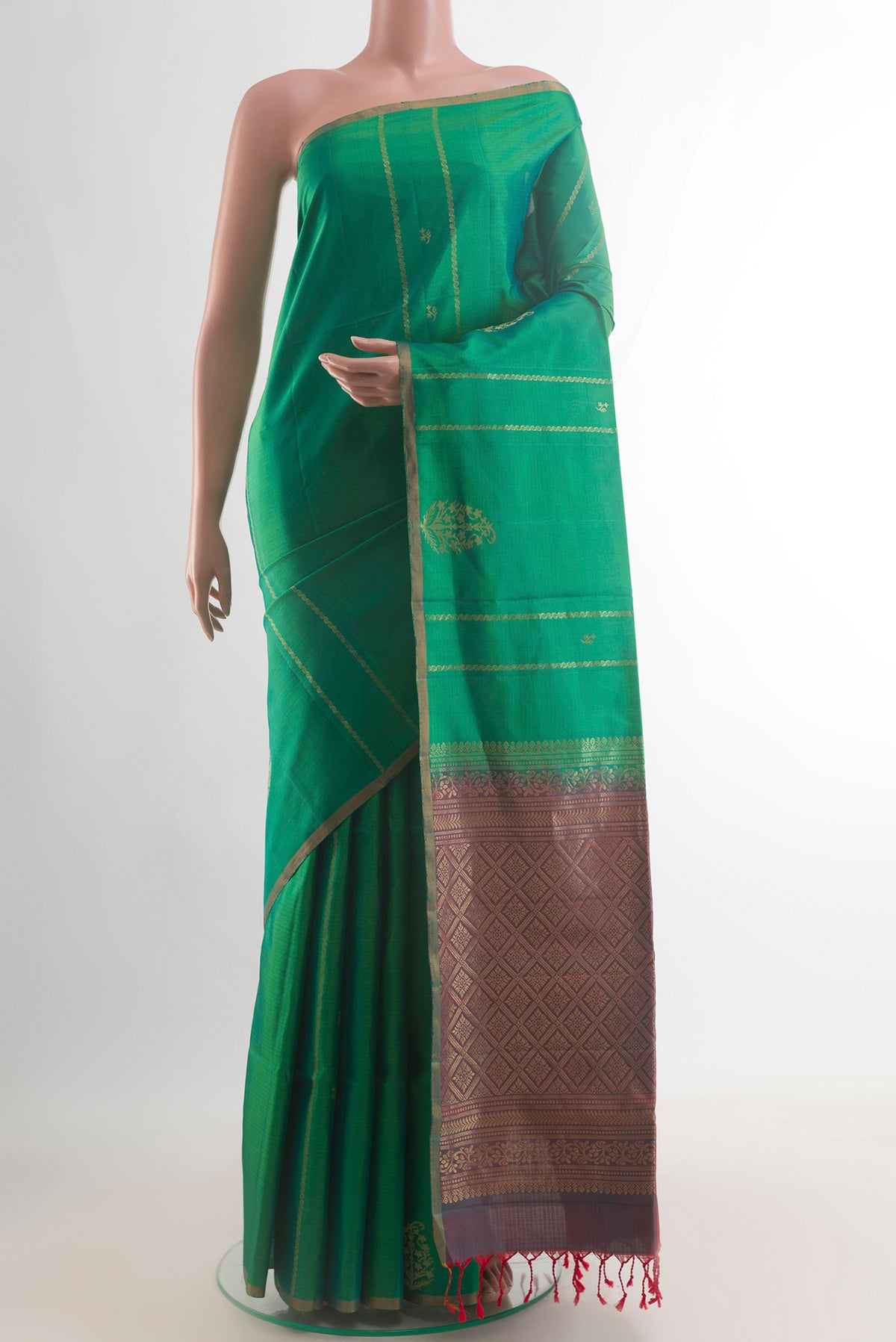 Pure Silk Green Soft Saree with Stripes on the body and Without Border.  displayed on a mannequin