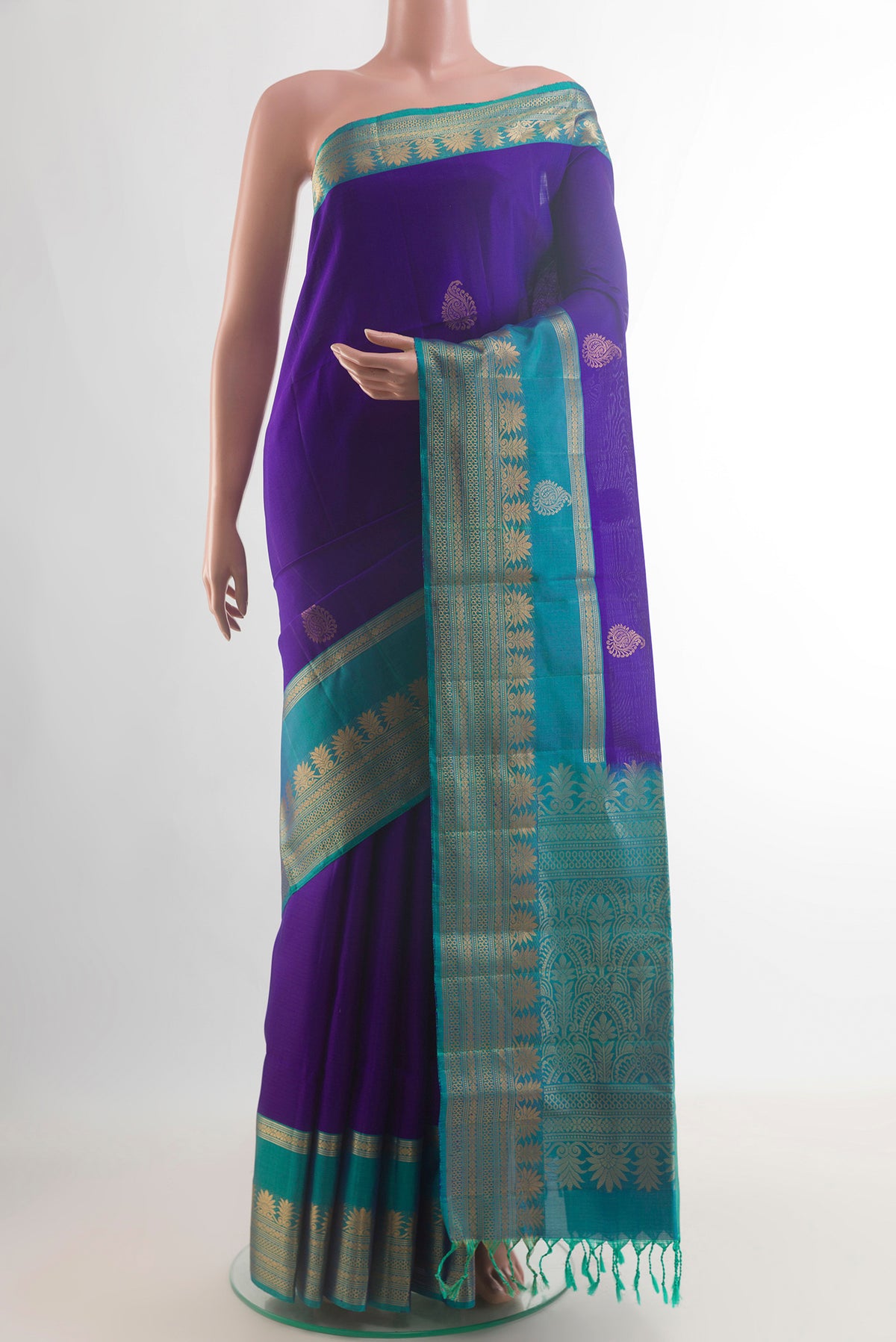 Pure Silk Blue Soft Saree with Zari Butta on the body and Zari Border.  displayed on a mannequin