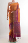 Pure Silk Mustard Soft Saree with Zari Butta on the body and Zari Border.  displayed on a mannequin