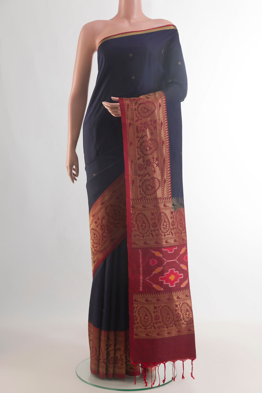 Pure Silk Navy Blue Soft Saree with Zari Butta on the body and Zari Border.  displayed on a mannequin