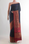 Pure Silk Navy Blue Soft Saree with Zari Butta on the body and Zari Border.  displayed on a mannequin