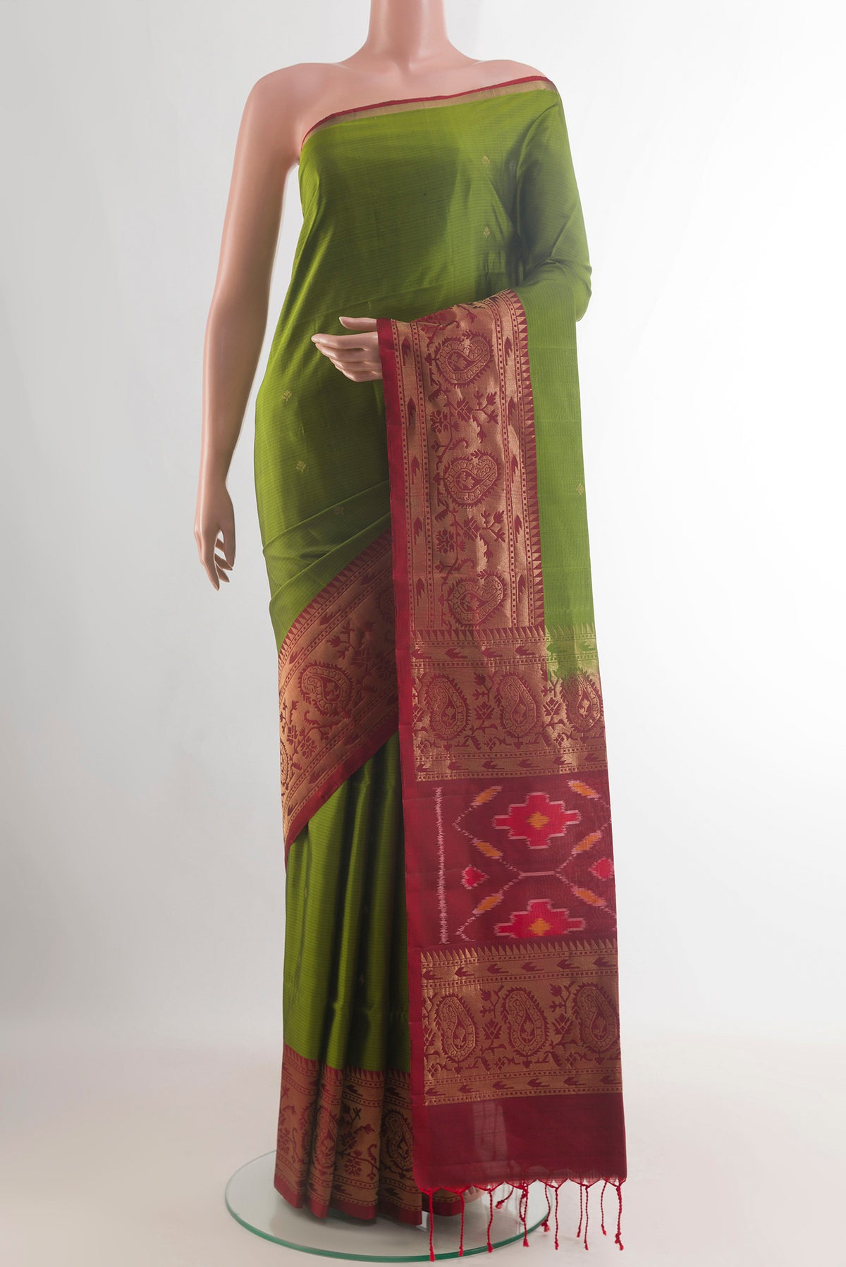 Pure Silk Green Soft Saree with Zari Butta on the body and Zari Border.  displayed on a mannequin