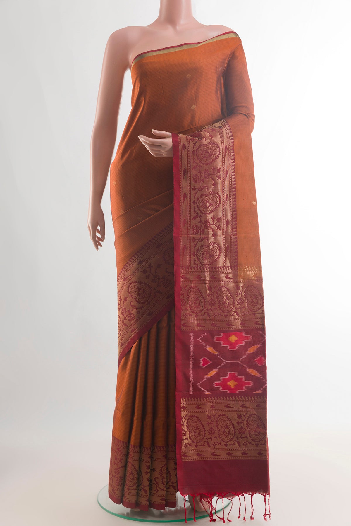 Pure Silk Mustard Soft Saree with Zari Butta on the body and Zari Border.  displayed on a mannequin
