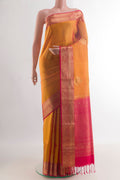 Pure Silk Yellow Kanjivaram Saree with Zari Butta on the body and Zari Border.  displayed on a mannequin