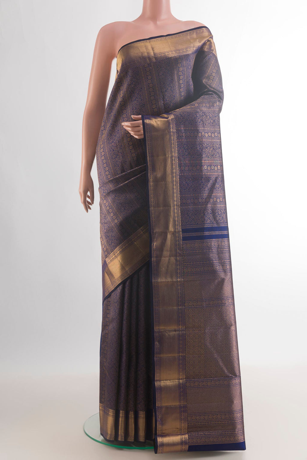 Pure Silk Navy Blue Kanchipuram Saree with Zari Brocade on the body and Zari Border.  displayed on a mannequin