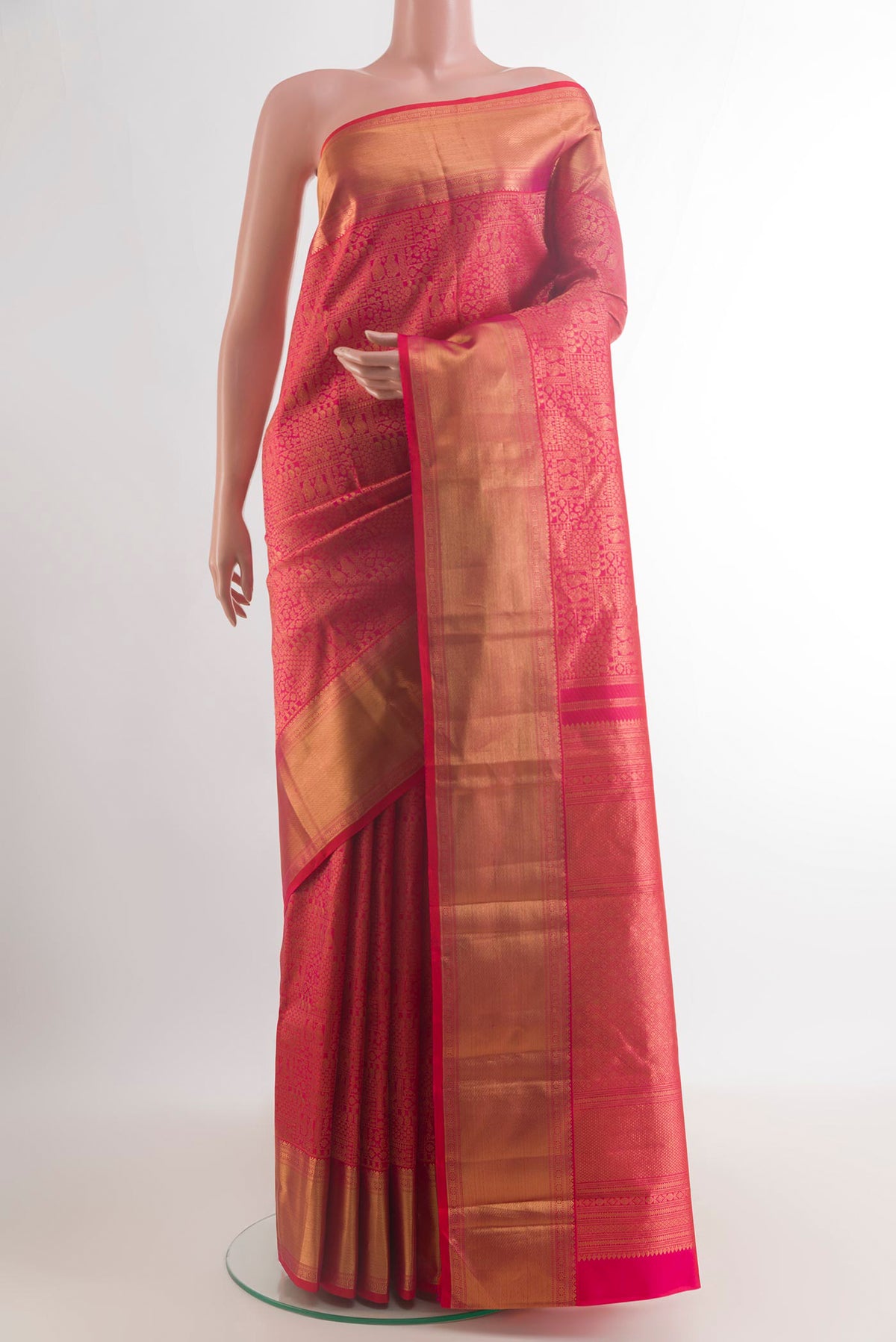 Pure Silk Red Kanchipuram Saree with Zari Brocade on the body and Zari Border.  displayed on a mannequin