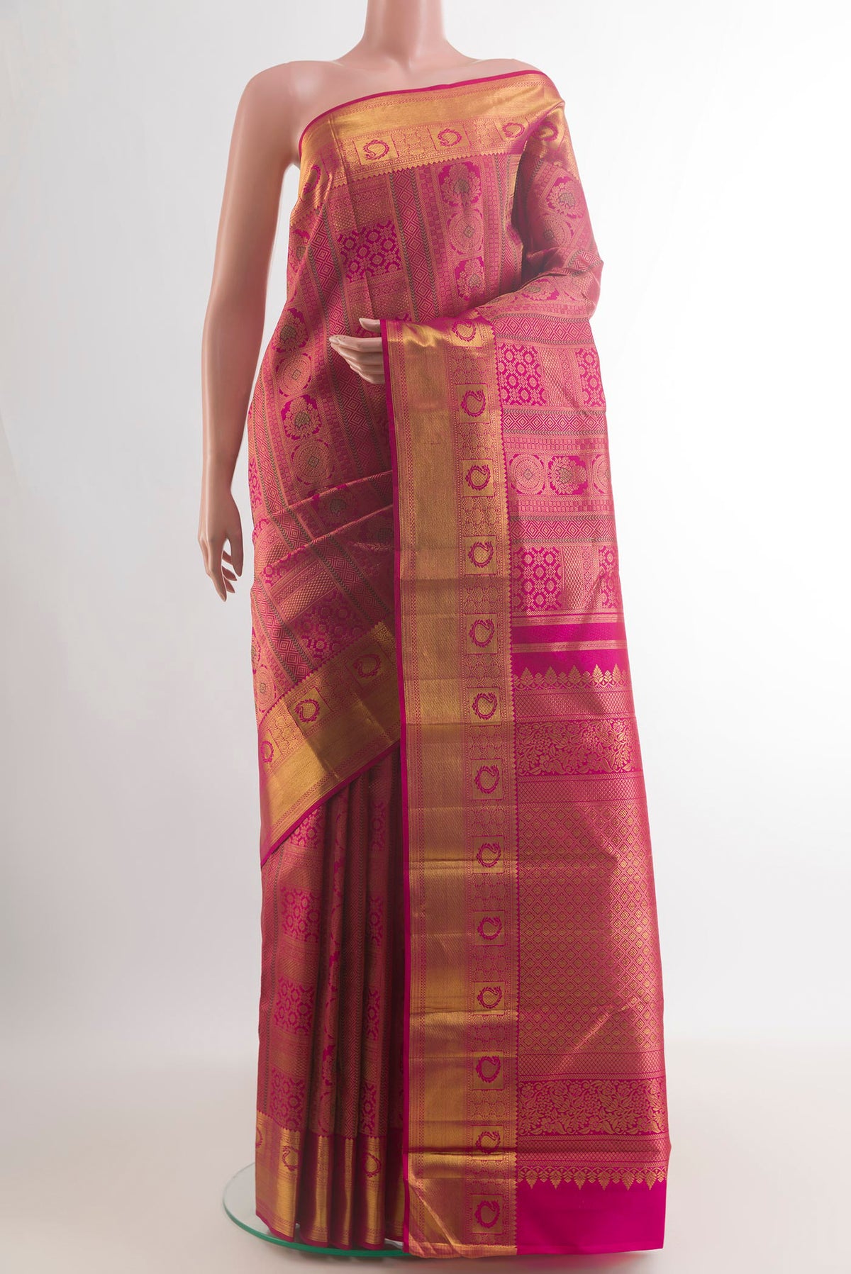 Pure Silk Pink Kanjivaram Saree with Zari Brocade on the body and Zari Border.  displayed on a mannequin