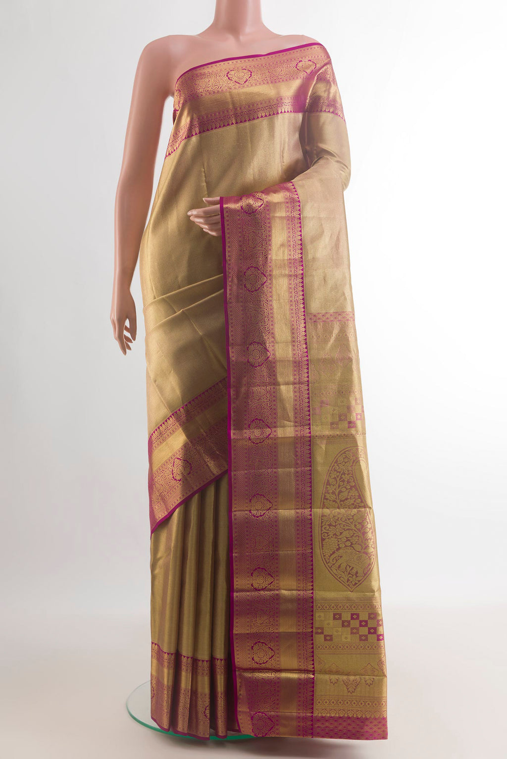 Golden Kanchipuram Tissue Saree with Zari Brocade on the body and Zari Border.  displayed on a mannequin