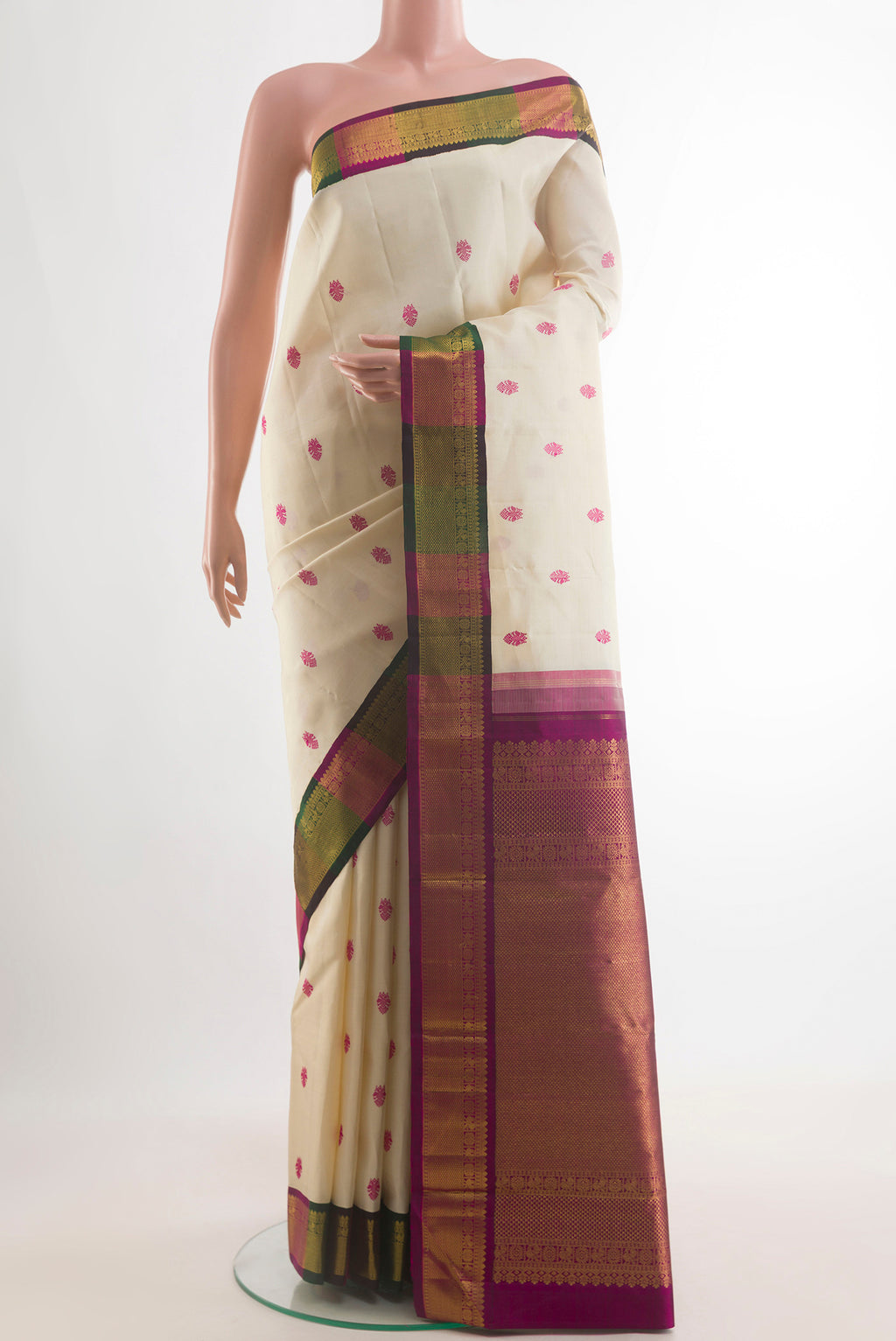 Pure Silk Off White Kanjivaram Saree with Thread Butta on the body and Zari Border.  displayed on a mannequin