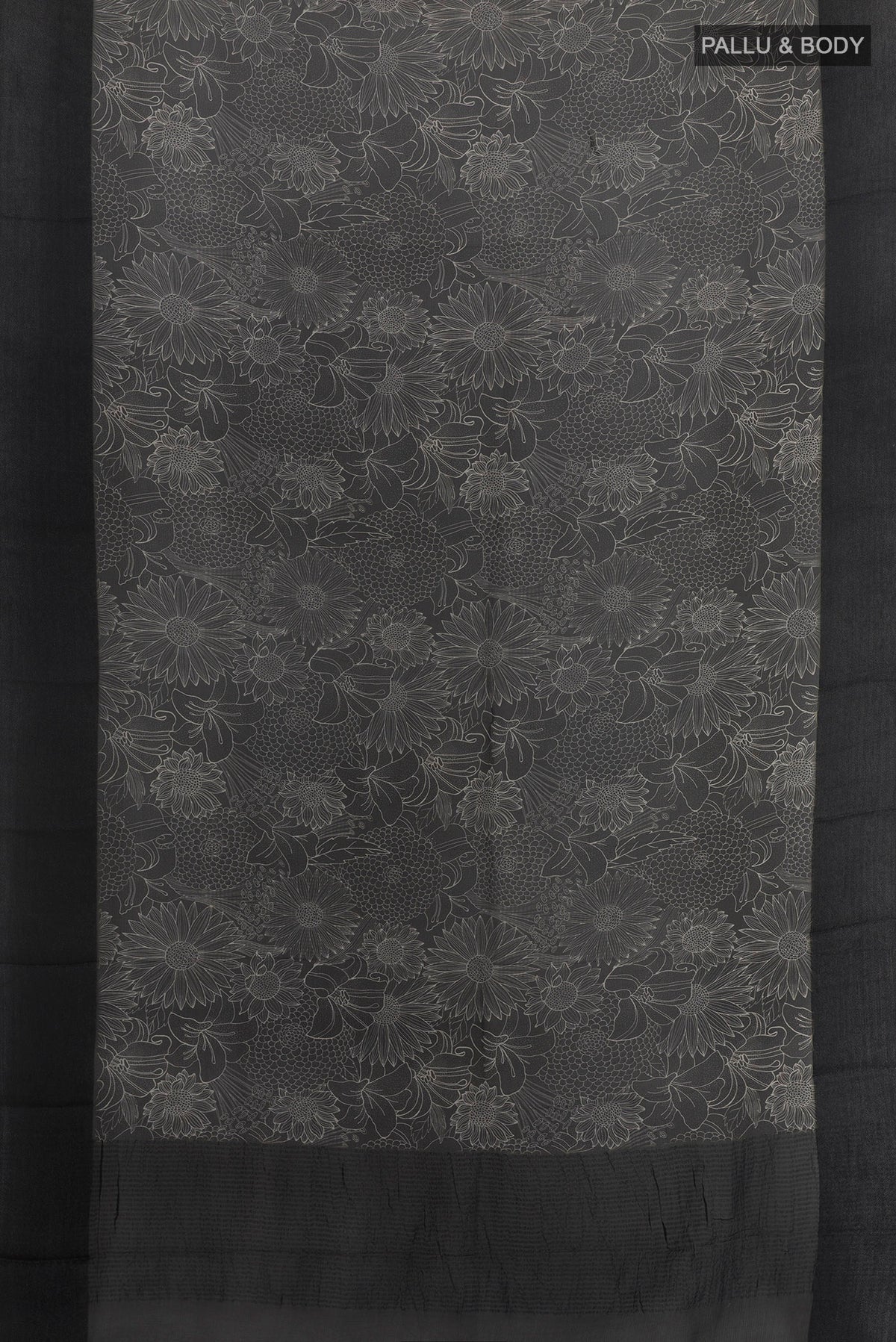 Flat view of Black Tussar Saree with Printed design on the body and Plain Border. 