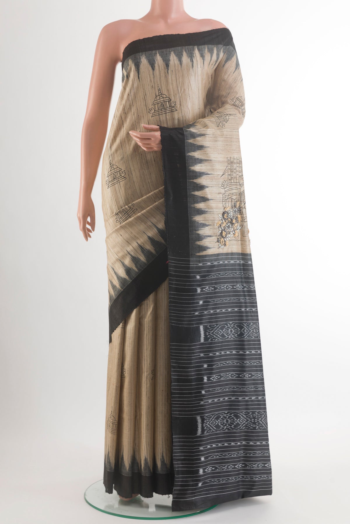 Beige Tussar Saree with Embroidery on the body and Plain Border.  displayed on a mannequin