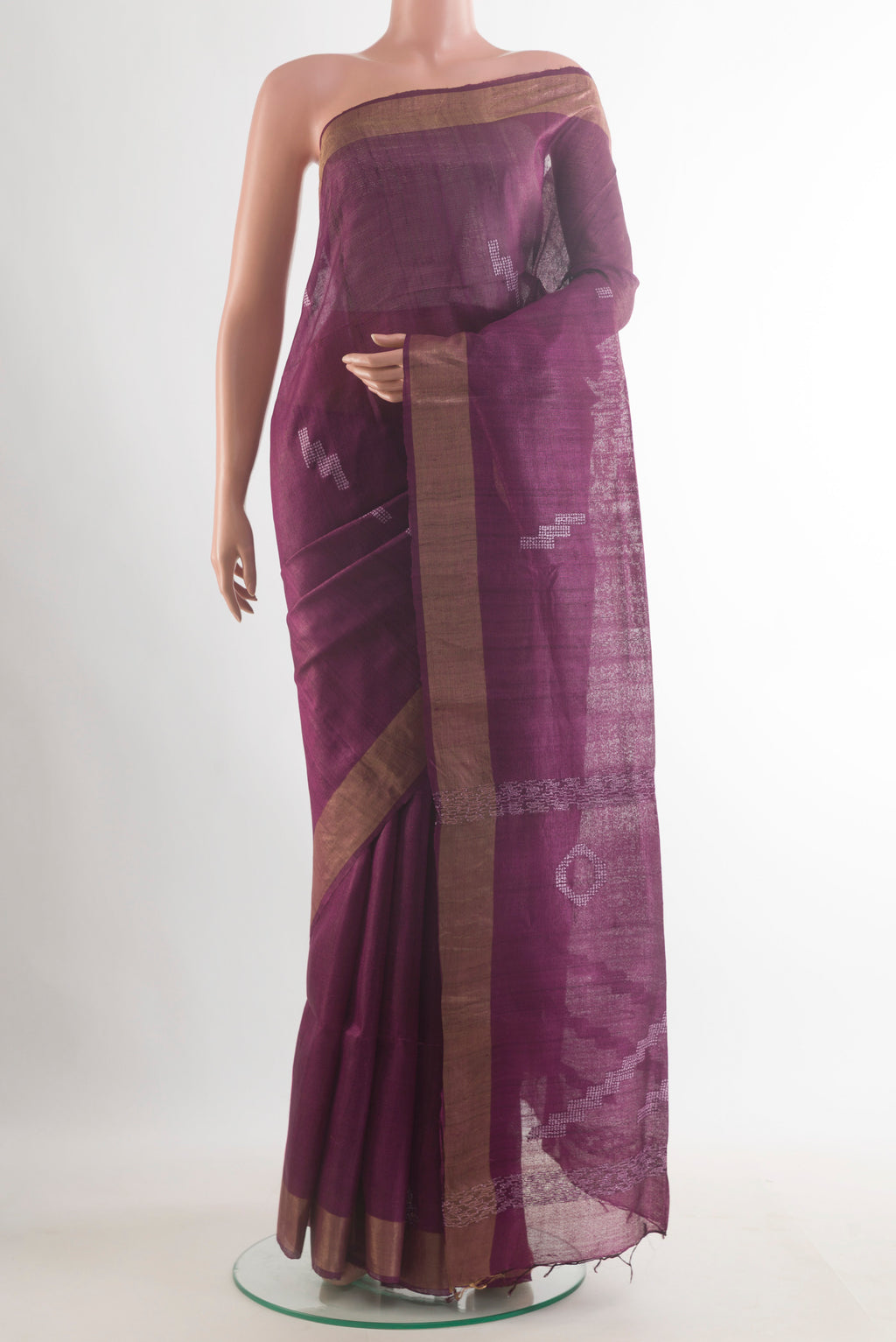Burgundy Tussar Saree with Embroidered on the body and Zari Border.  displayed on a mannequin