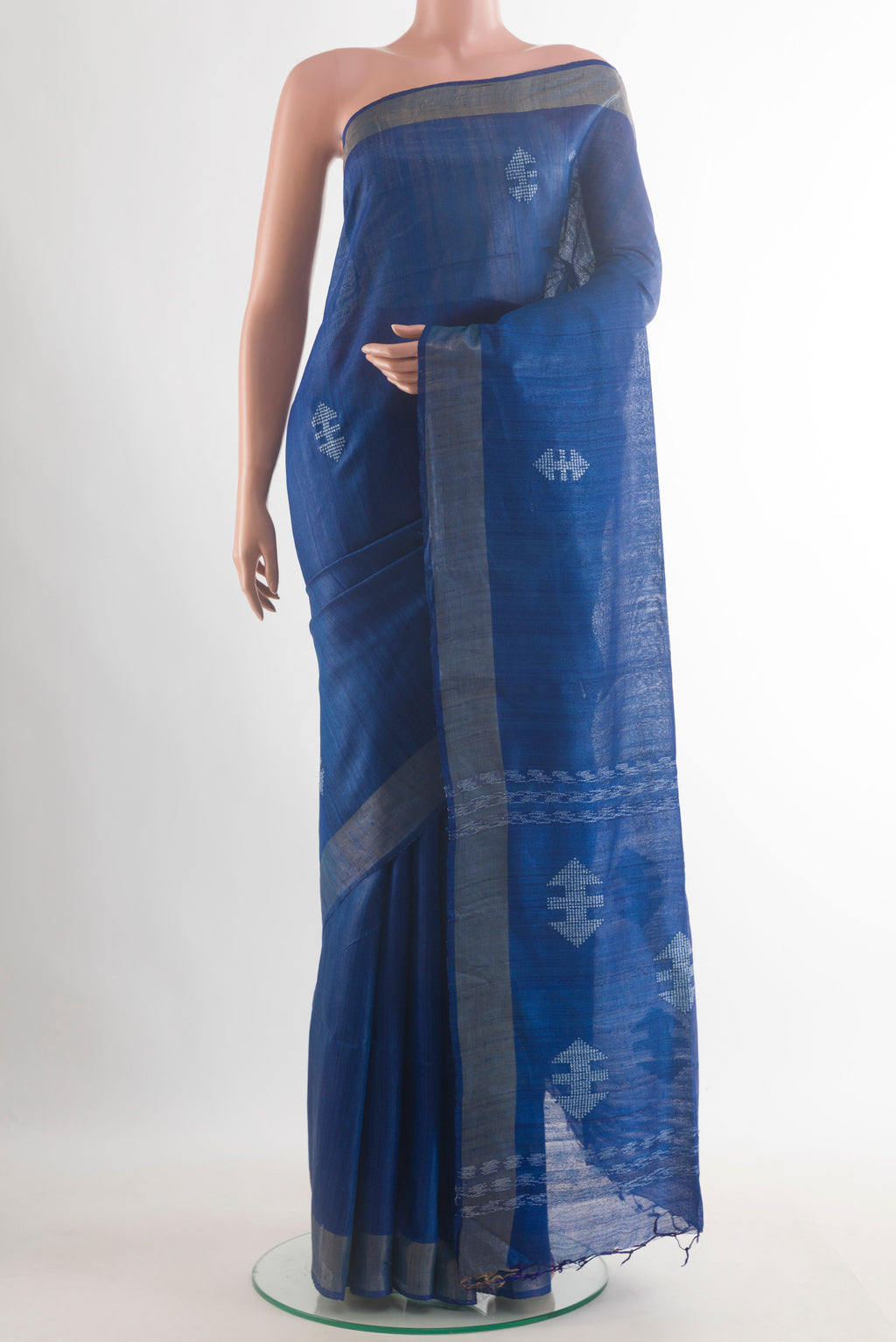 Blue Tussar Saree with Embroidered on the body and Zari Border.  displayed on a mannequin