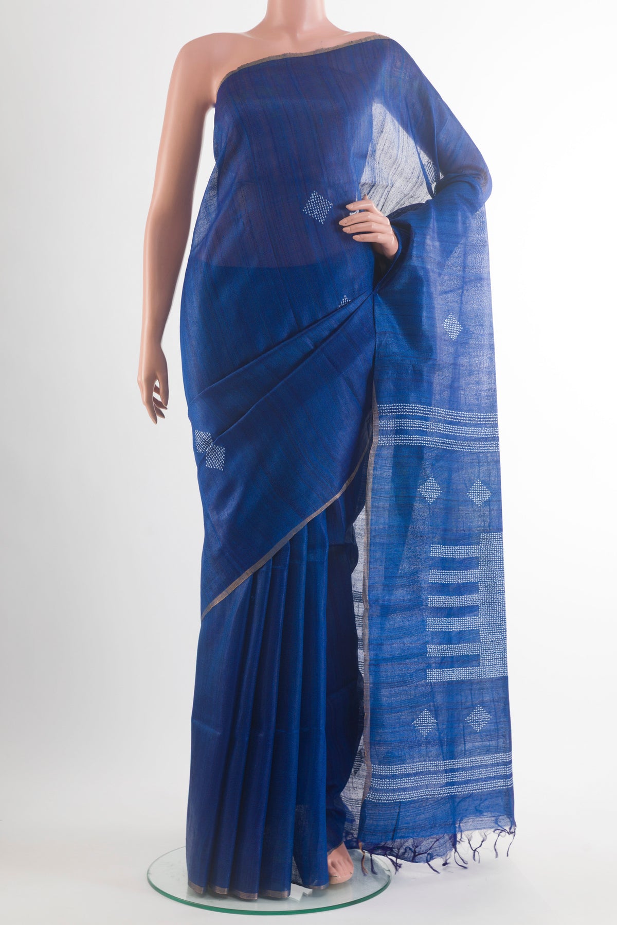 Royal Blue Tussar Saree with Thread Butta on the body and Zari Border.  displayed on a mannequin