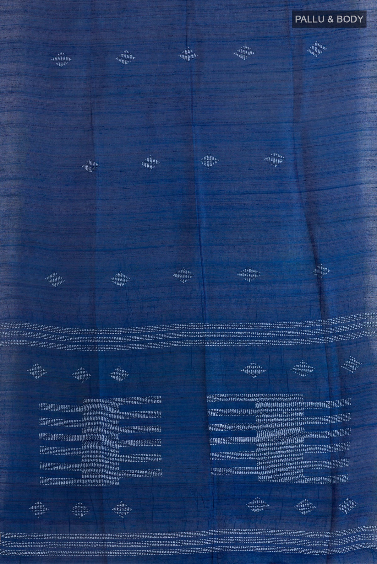 Flat view of Royal Blue Tussar Saree with Thread Butta on the body and Zari Border. 