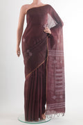 Brown Tussar Saree with Embroidery on the body and Zari Border.  displayed on a mannequin