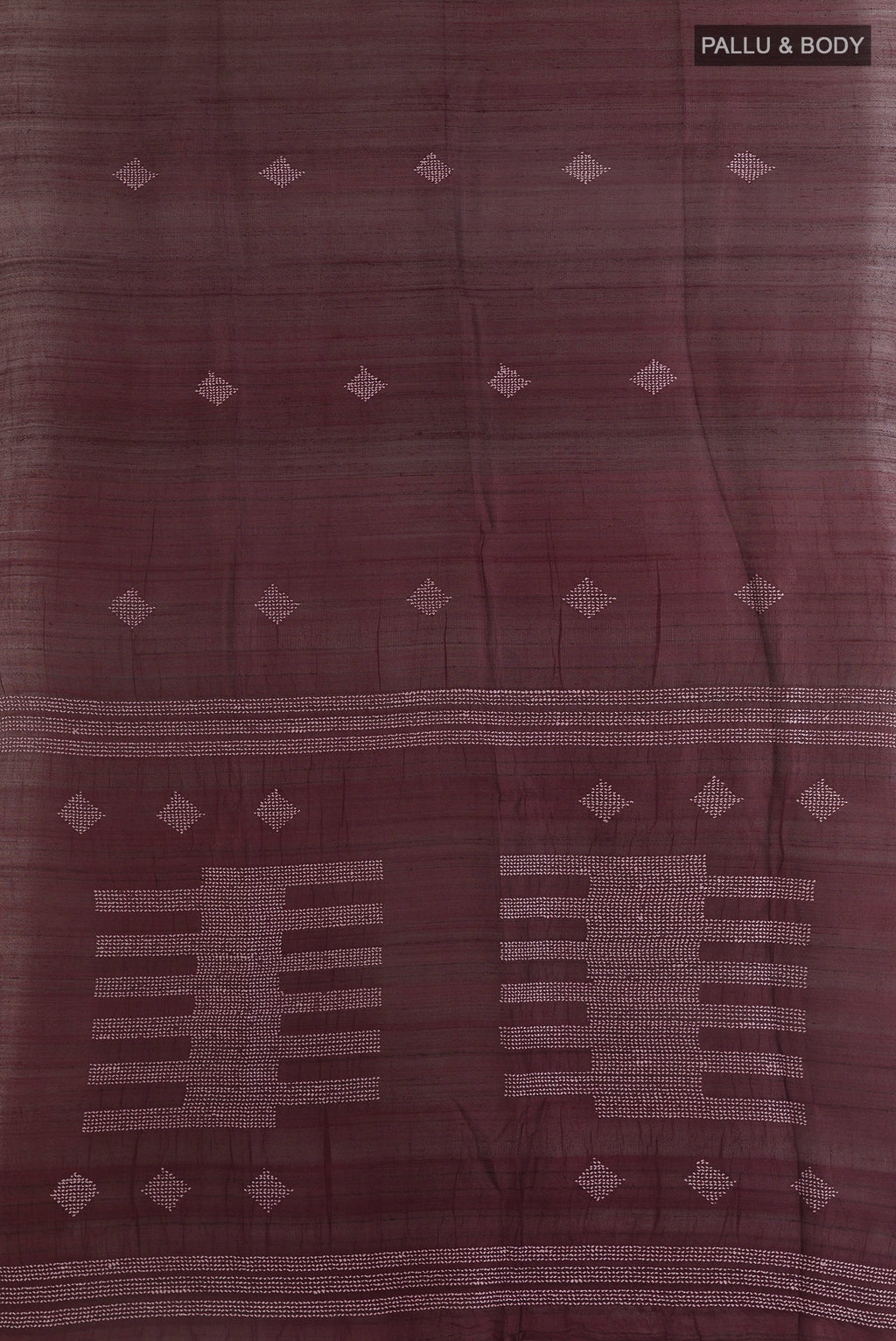 Flat view of Brown Tussar Saree with Embroidery on the body and Zari Border. 