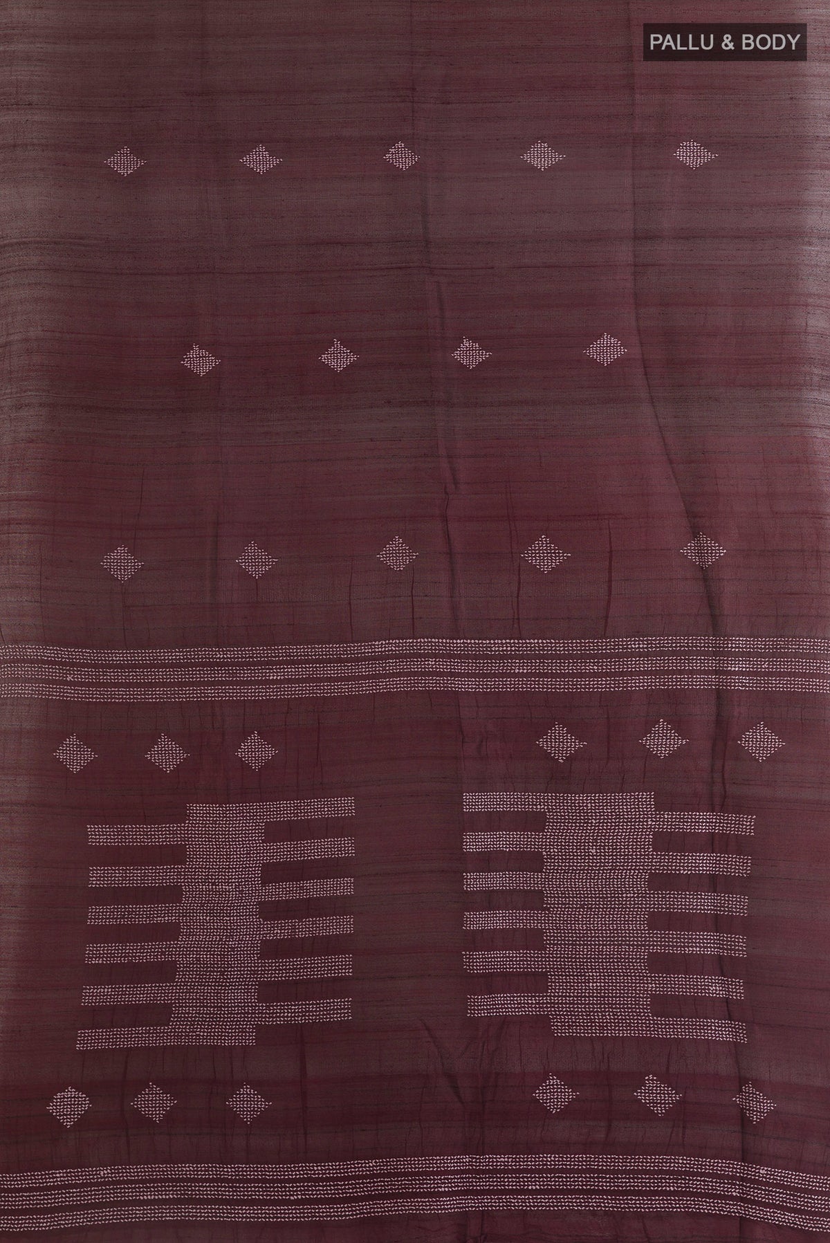 Flat view of Brown Tussar Saree with Embroidery on the body and Zari Border. 