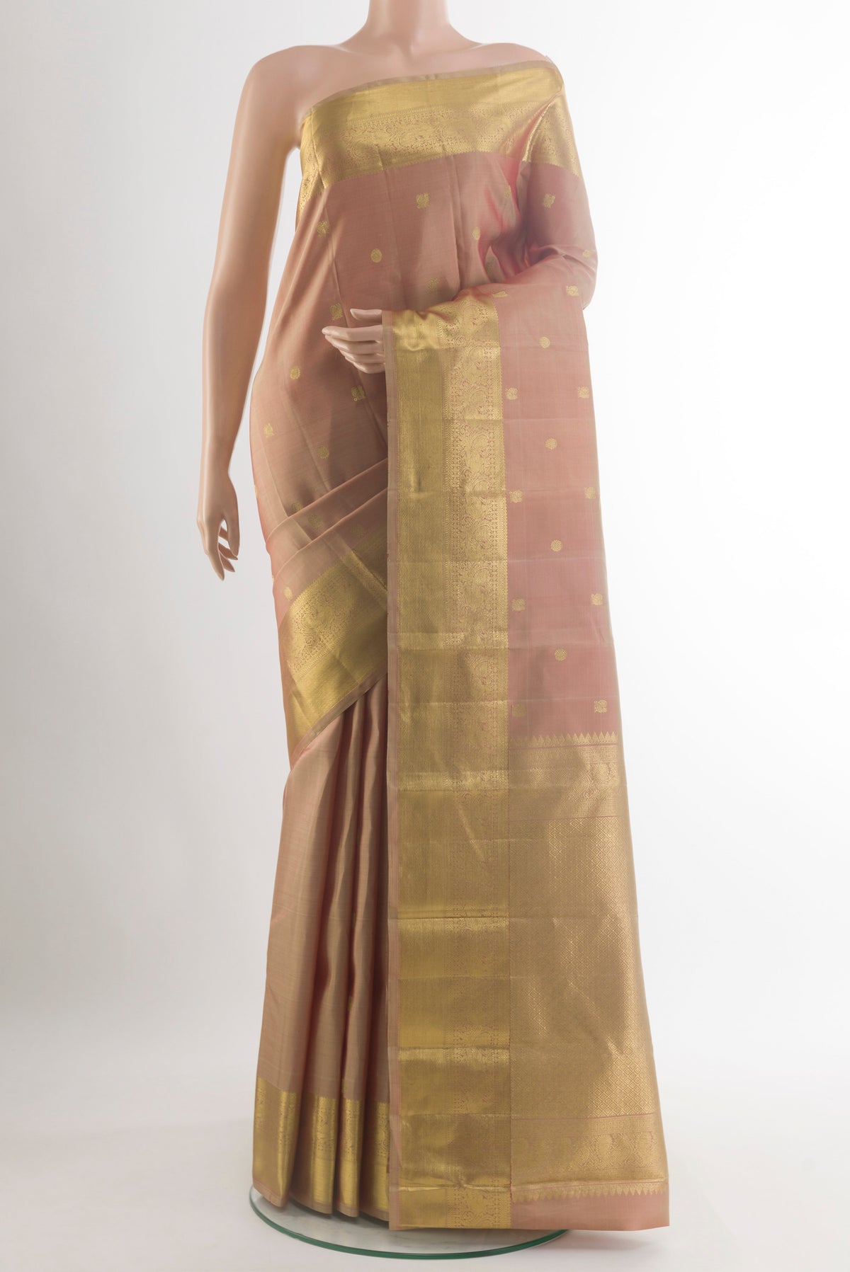 Pure Silk Beige Kanchipuram Saree with Zari Butta on the body and Zari Border.  displayed on a mannequin