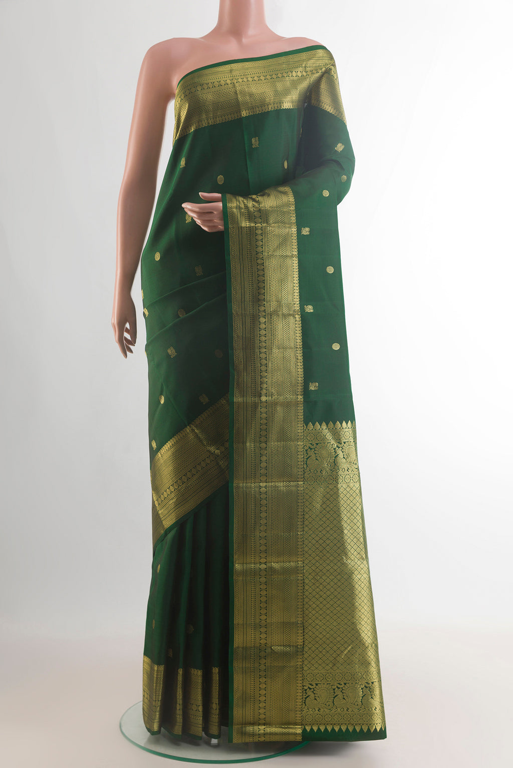 Pure Silk Green Kanchipuram Saree with Zari Butta on the body and Zari Border.  displayed on a mannequin