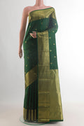 Pure Silk Green Kanchipuram Saree with Zari Butta on the body and Zari Border.  displayed on a mannequin