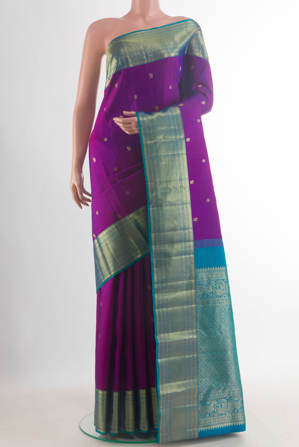 Pure Silk Purple Kanchipuram Saree with Zari Butta on the body and Zari Border.  displayed on a mannequin