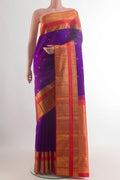 Pure Silk Purple Kanchipuram Saree with Zari Butta on the body and Zari Border.  displayed on a mannequin