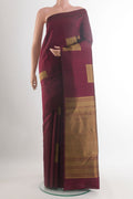 Pure Silk Maroon Kanchipuram Saree with Zari Butta on the body and Without Border.  displayed on a mannequin