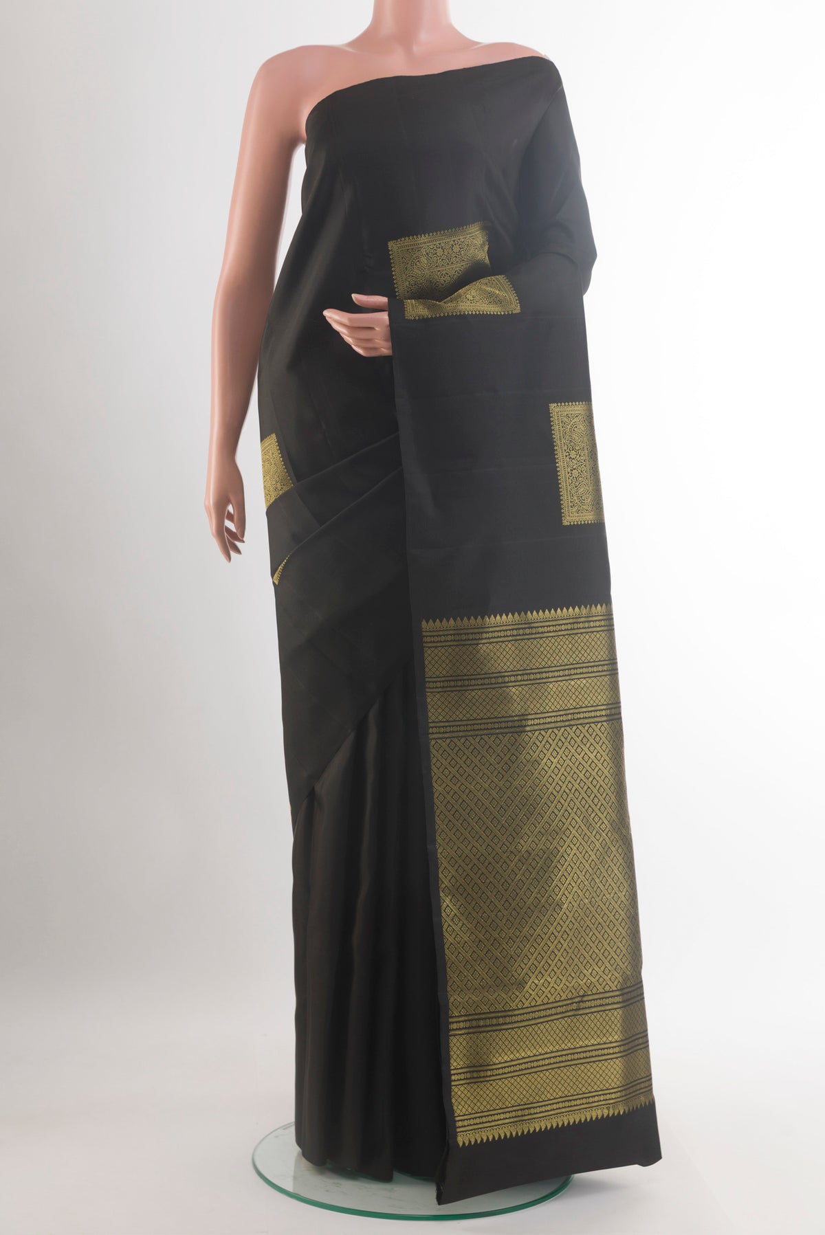 Pure Silk Black Kanchipuram Saree with Zari Butta on the body and Without Border.  displayed on a mannequin