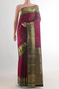 Pure Silk Maroon Kanchipuram Saree with Zari Butta on the body and Zari Border.  displayed on a mannequin