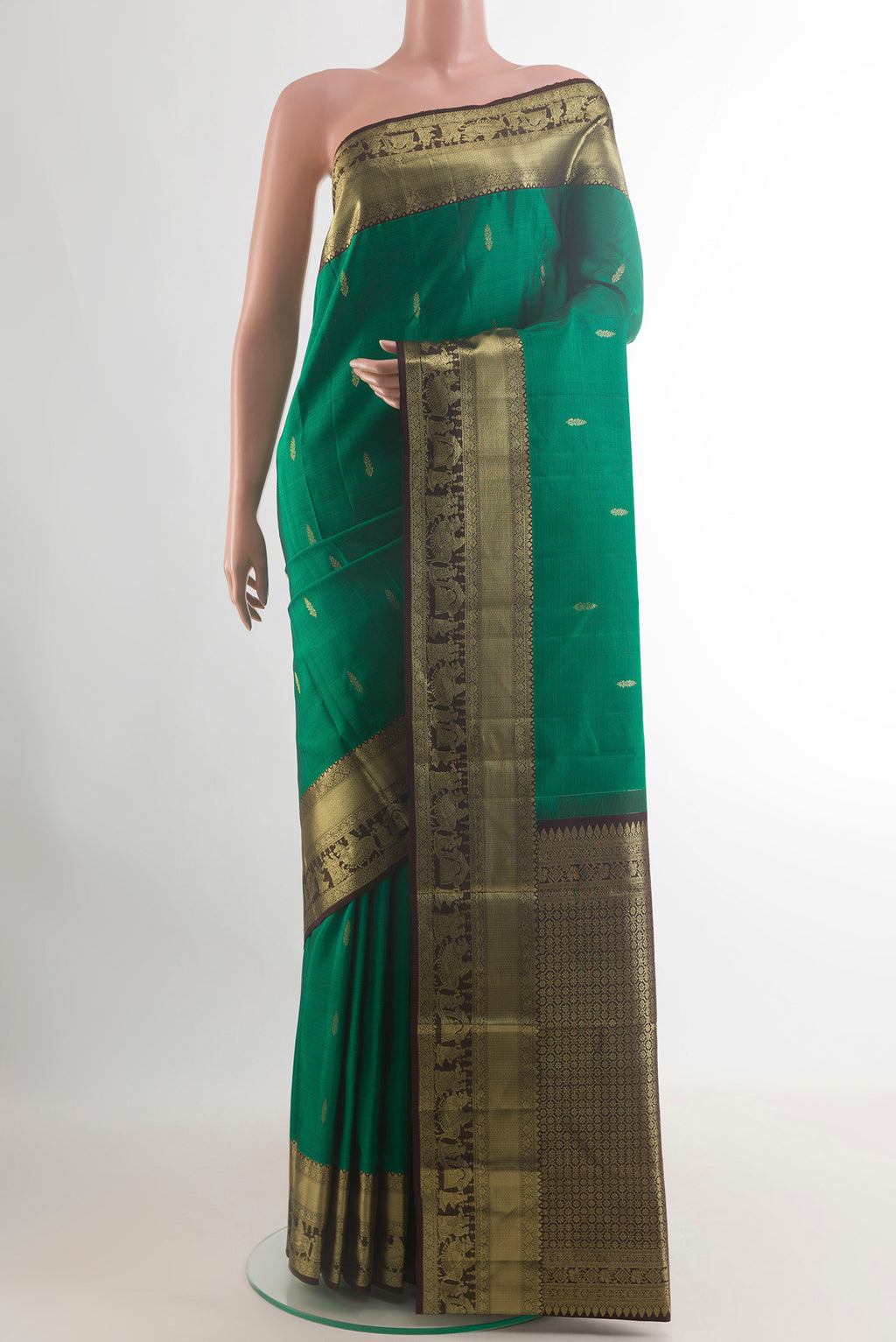 Pure Silk Green Kanchipuram Saree with Zari Butta on the body and Zari Border.  displayed on a mannequin