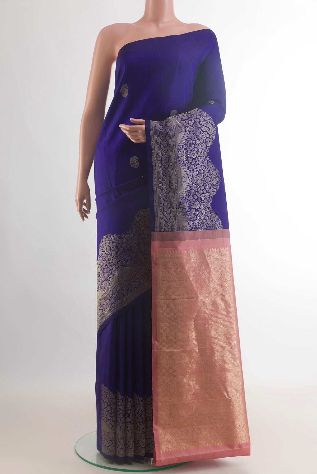 Pure Silk Pure Zari Blue Kanjivaram Saree with Zari Butta on the body and Zari Border.  displayed on a mannequin