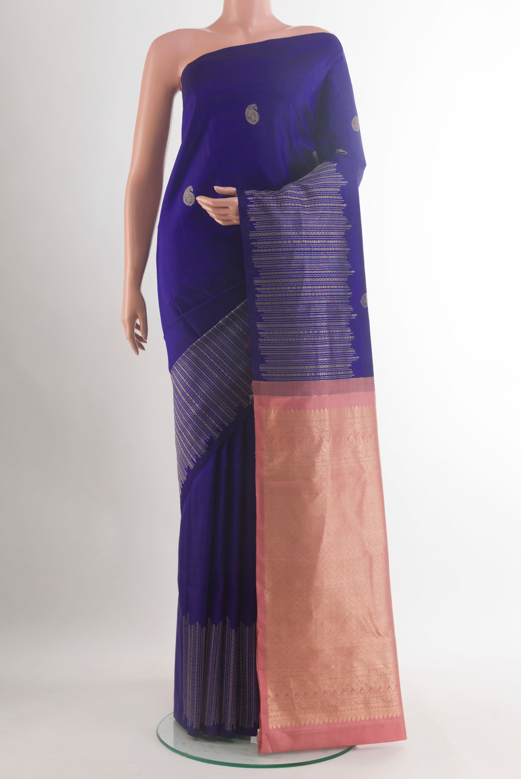 Pure Silk Dark Blue Kanjivaram Saree with Zari Butta on the body and Zari Border.  displayed on a mannequin