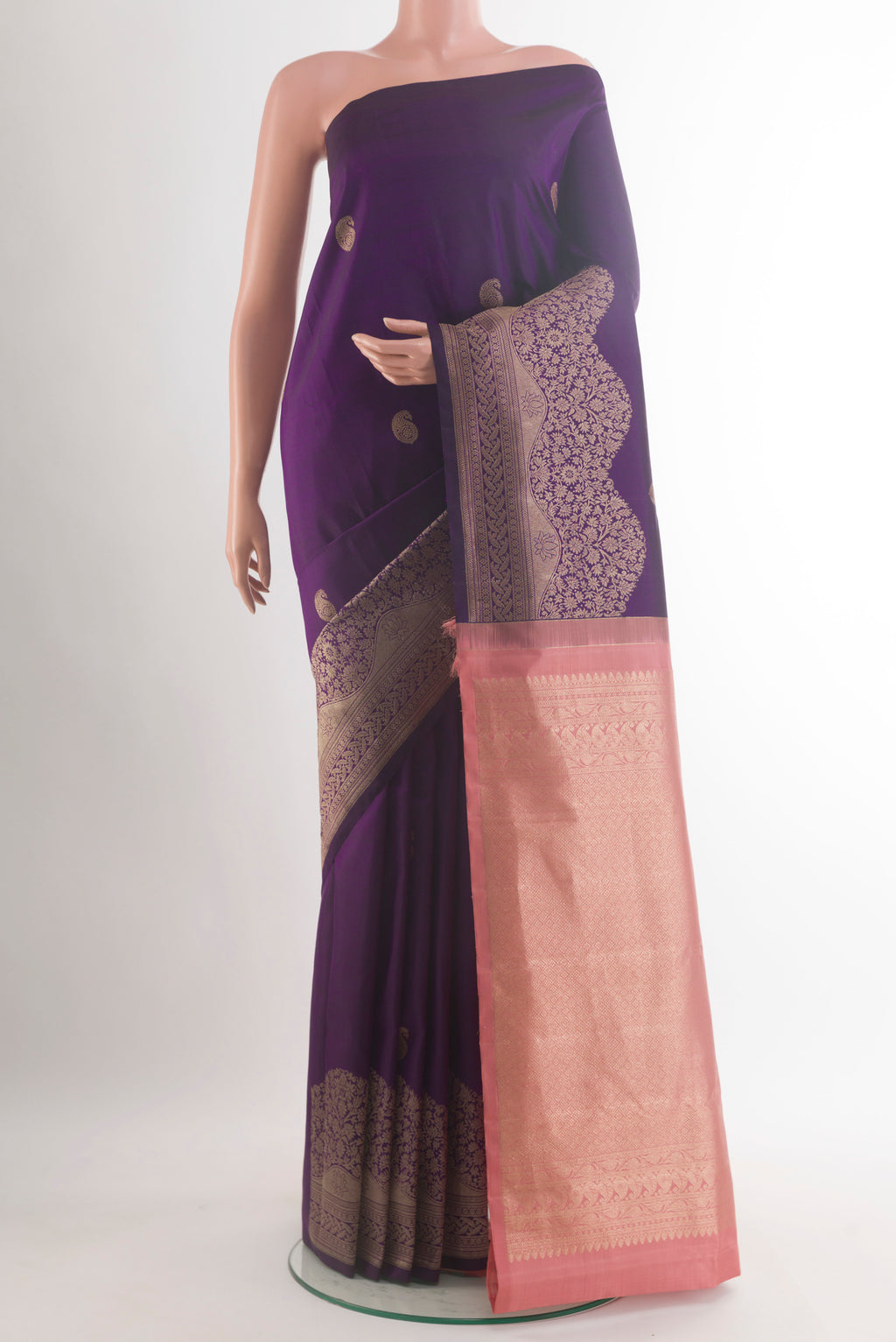 Pure Silk Purple Kanjivaram Saree with Zari Butta on the body and Zari Border.  displayed on a mannequin