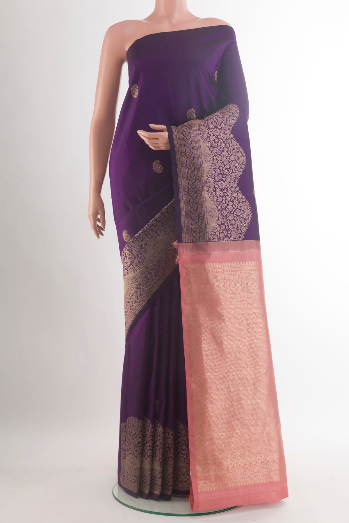 Pure Silk Purple Kanjivaram Saree with Zari Butta on the body and Zari Border.  displayed on a mannequin