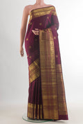Pure Silk Coffee Brown Kanchipuram Saree with Zari Butta on the body and Zari Border.  displayed on a mannequin