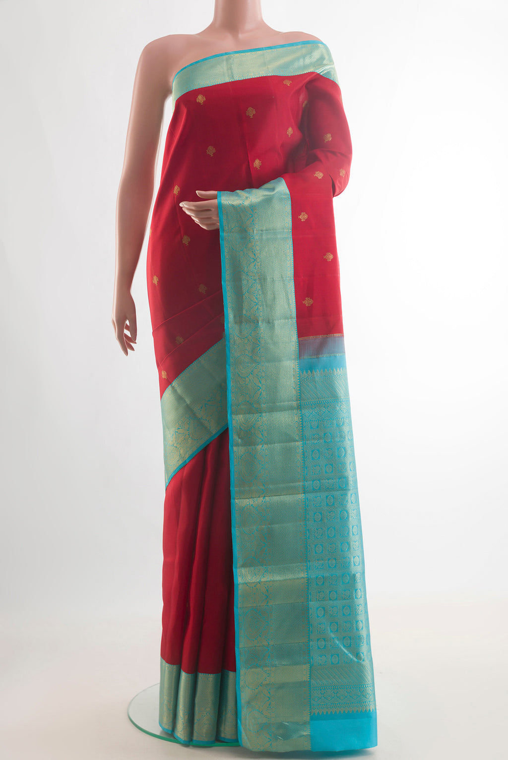 Pure Silk Red Kanjivaram Saree with Zari Butta on the body and Zari Border.  displayed on a mannequin