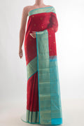 Pure Silk Red Kanjivaram Saree with Zari Butta on the body and Zari Border.  displayed on a mannequin
