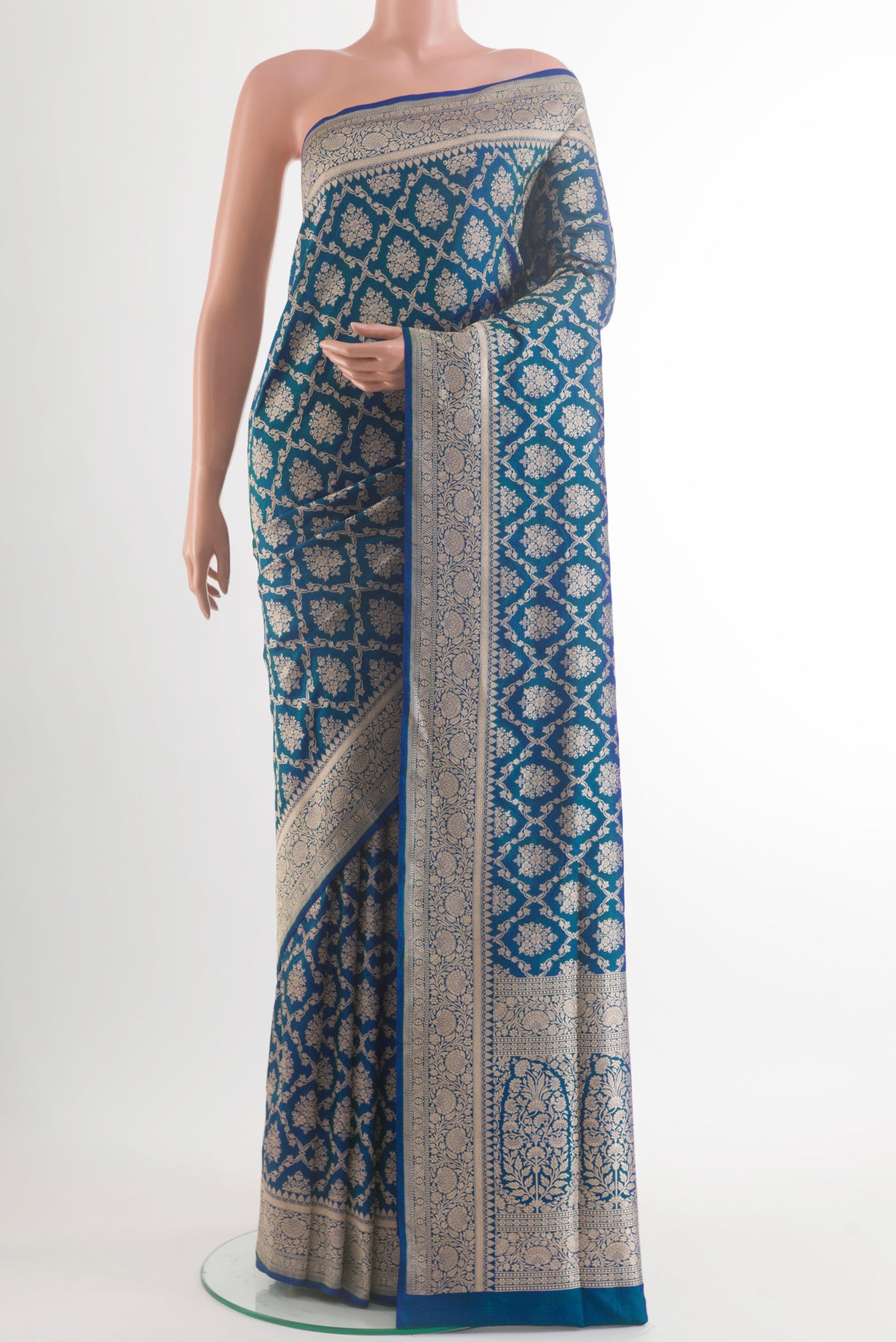 Pure Silk Peacock Blue Banarasi Saree with Zari Brocade on the body and Zari Border.  displayed on a mannequin