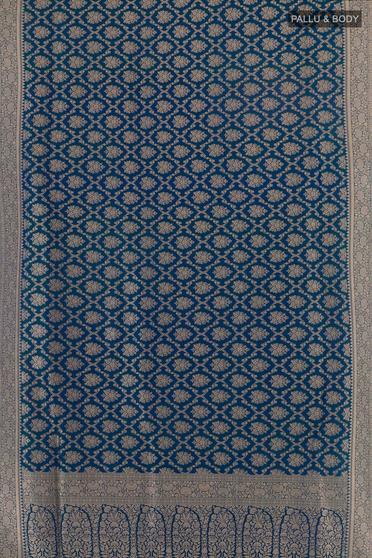 Flat view of Pure Silk Peacock Blue Banarasi Saree with Zari Brocade on the body and Zari Border. 