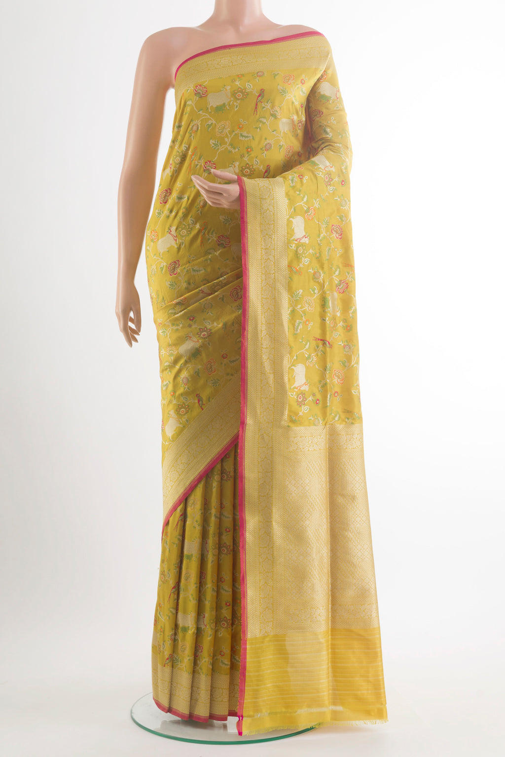 Pure Silk Yellow Banarasi Saree with Zari And Thread Butta on the body and Zari Border.  displayed on a mannequin