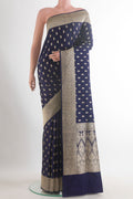 Navy Blue Banarasi Saree with Zari Butta on the body and Zari Border.  displayed on a mannequin