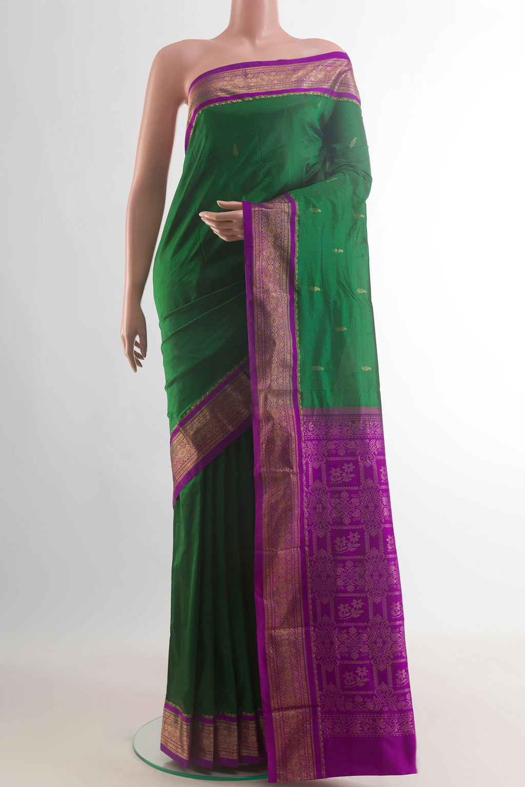 Pure Silk Green Bangalore Saree with Zari Butta on the body and Zari Border.  displayed on a mannequin