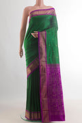 Pure Silk Green Bangalore Saree with Zari Butta on the body and Zari Border.  displayed on a mannequin